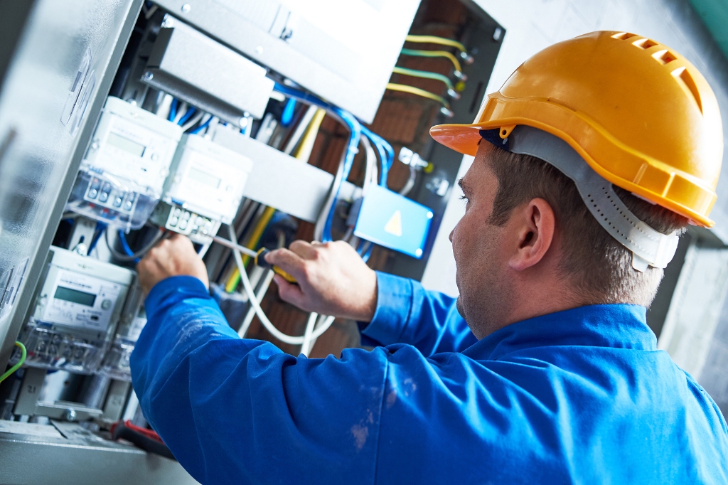 Electrician installing energy saving meter