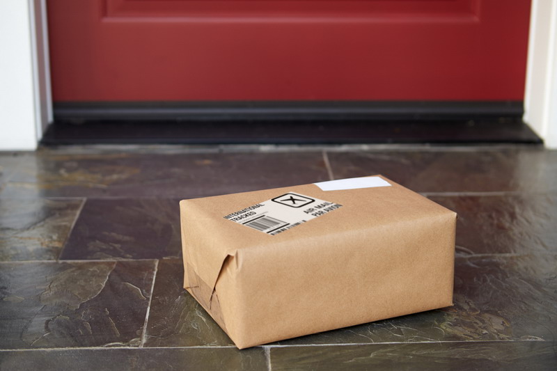 Close Up Of Parcel Delivery Outside Front Door