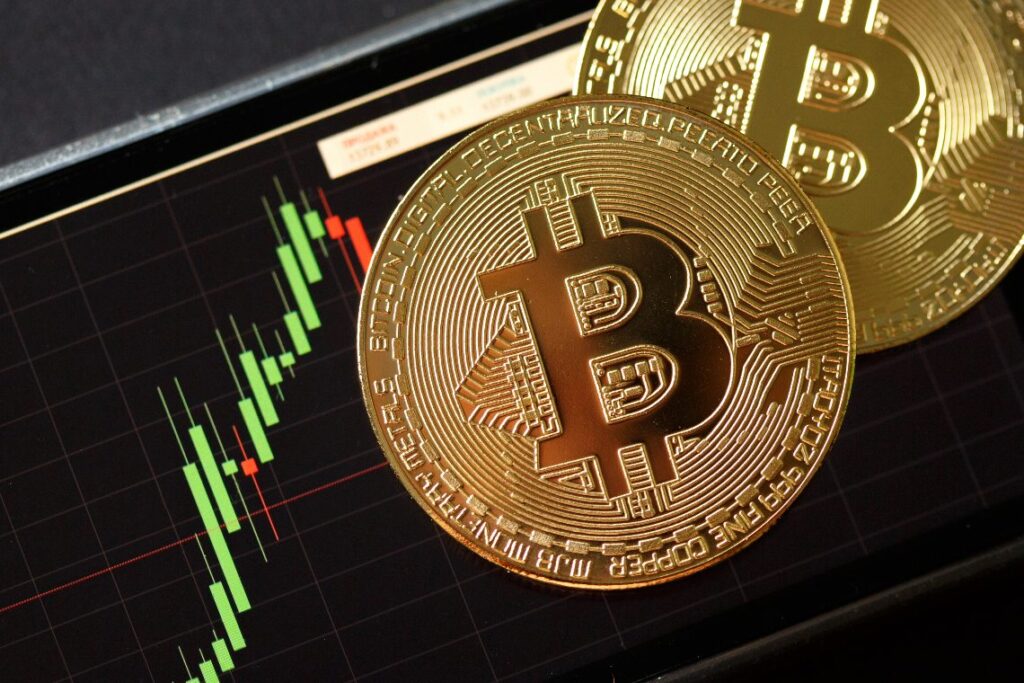 Bitcoin gold coin and chart background. Virtual cryptocurrency concept.