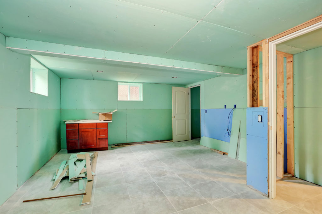 Basement renovation. Mint green walls and tile floor