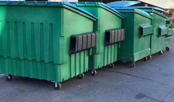 Garbage Dumpsters next to each other.