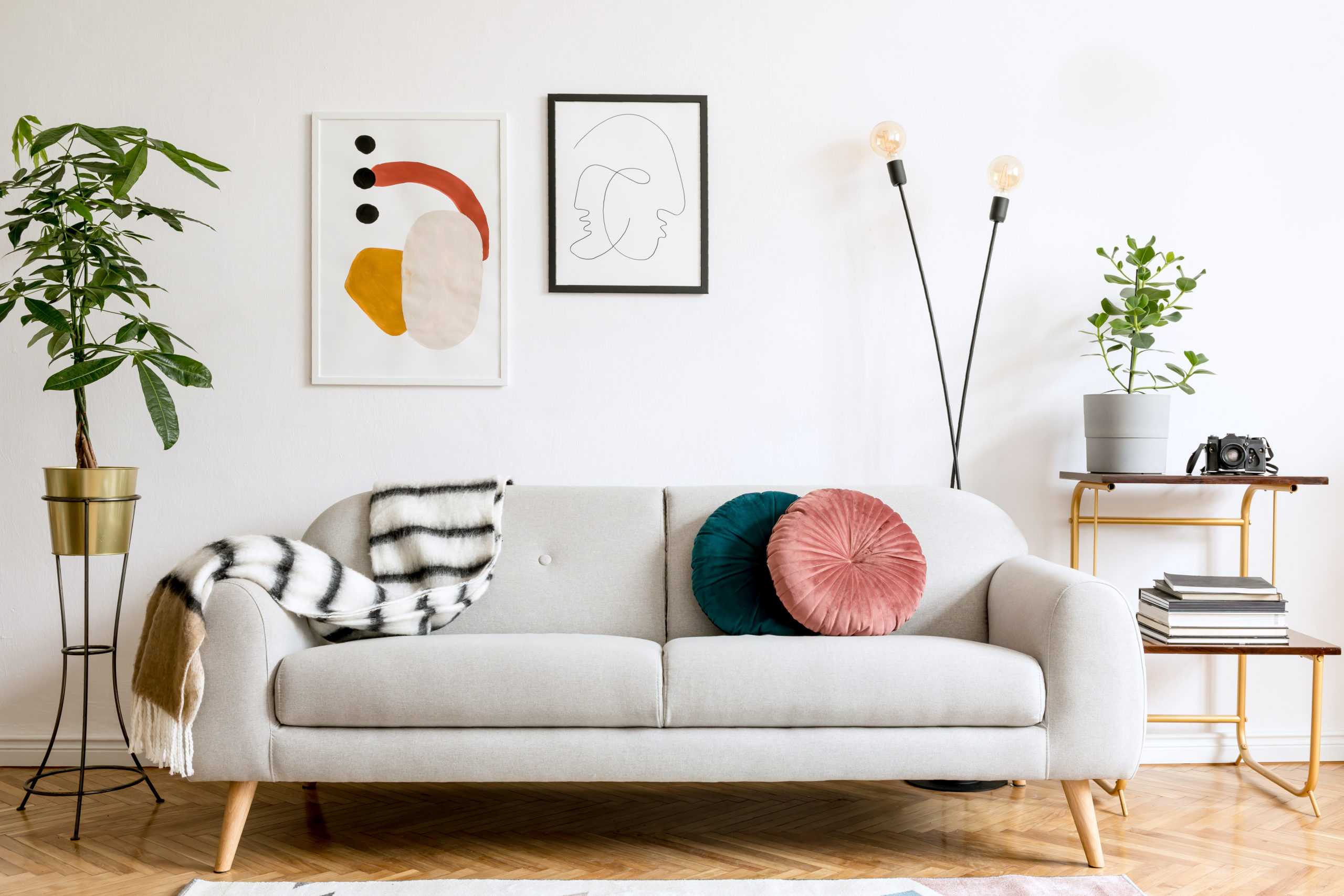 Minimalist interior design of living room with sofa and framed p