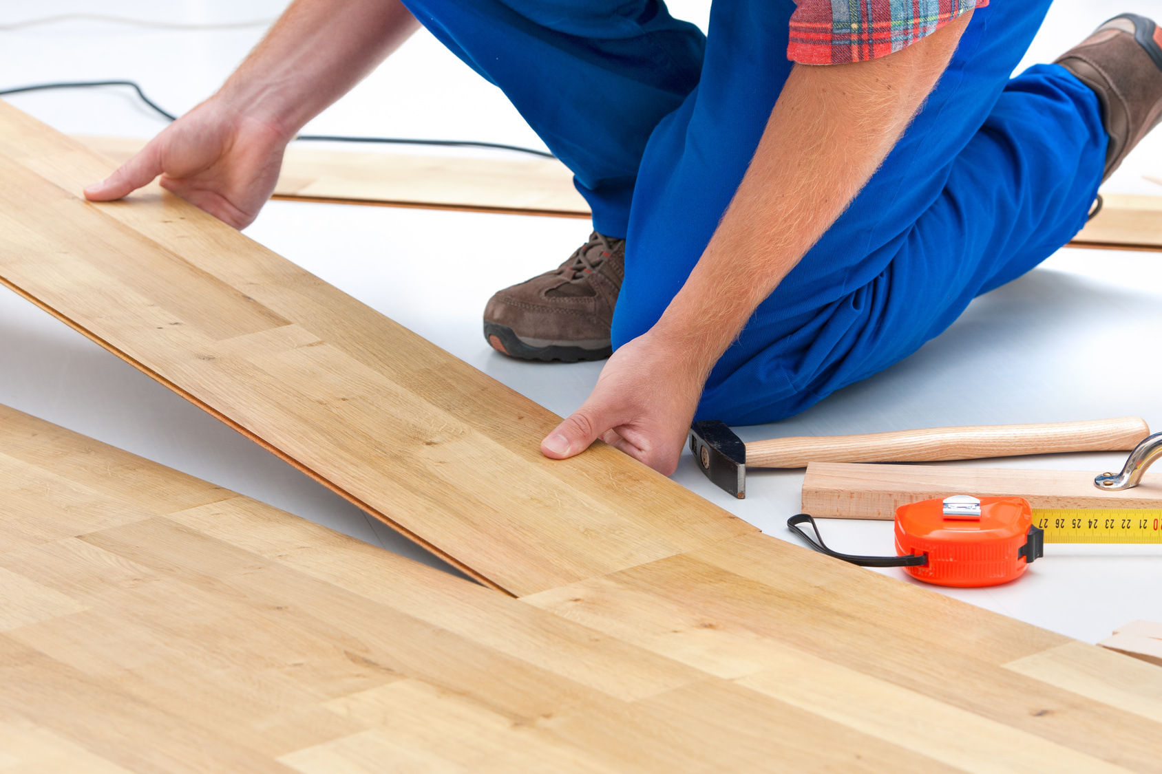 Man laying laminate flooring