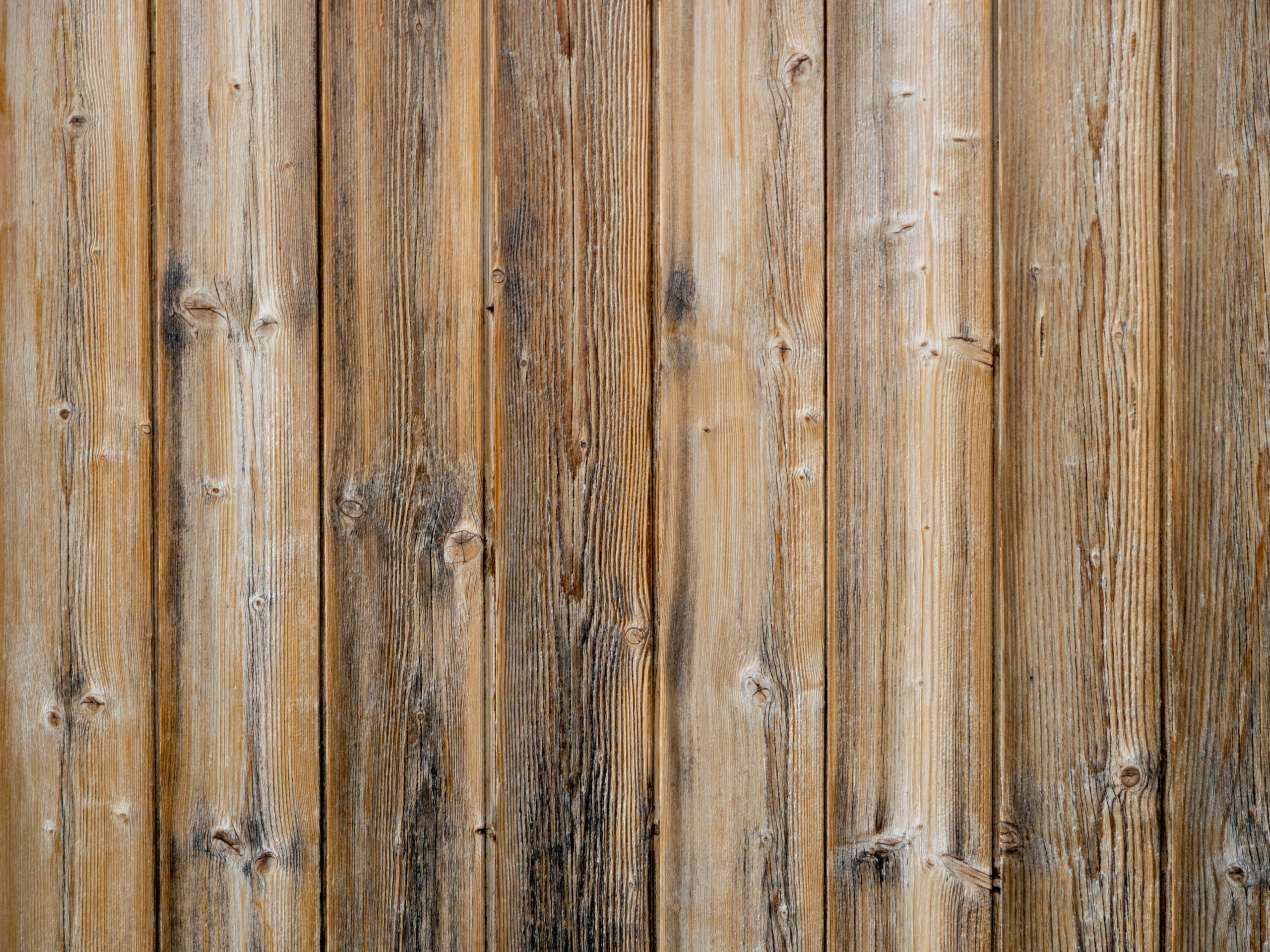 Wood slats background,old exterior cladding with vertical planks.