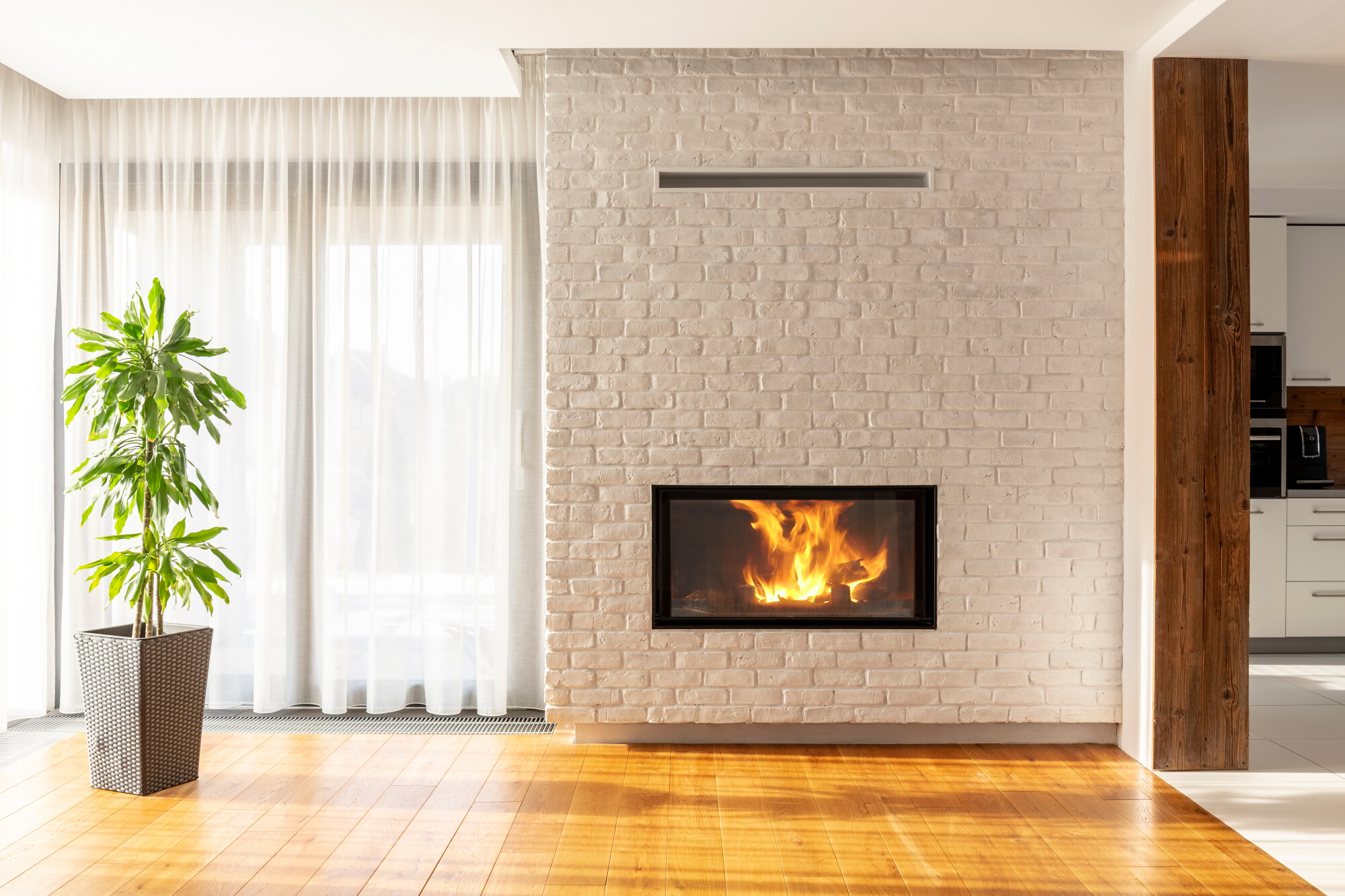 Fireplace,On,Brick,Wall,In,Bright,Living,Room,Interior,Of