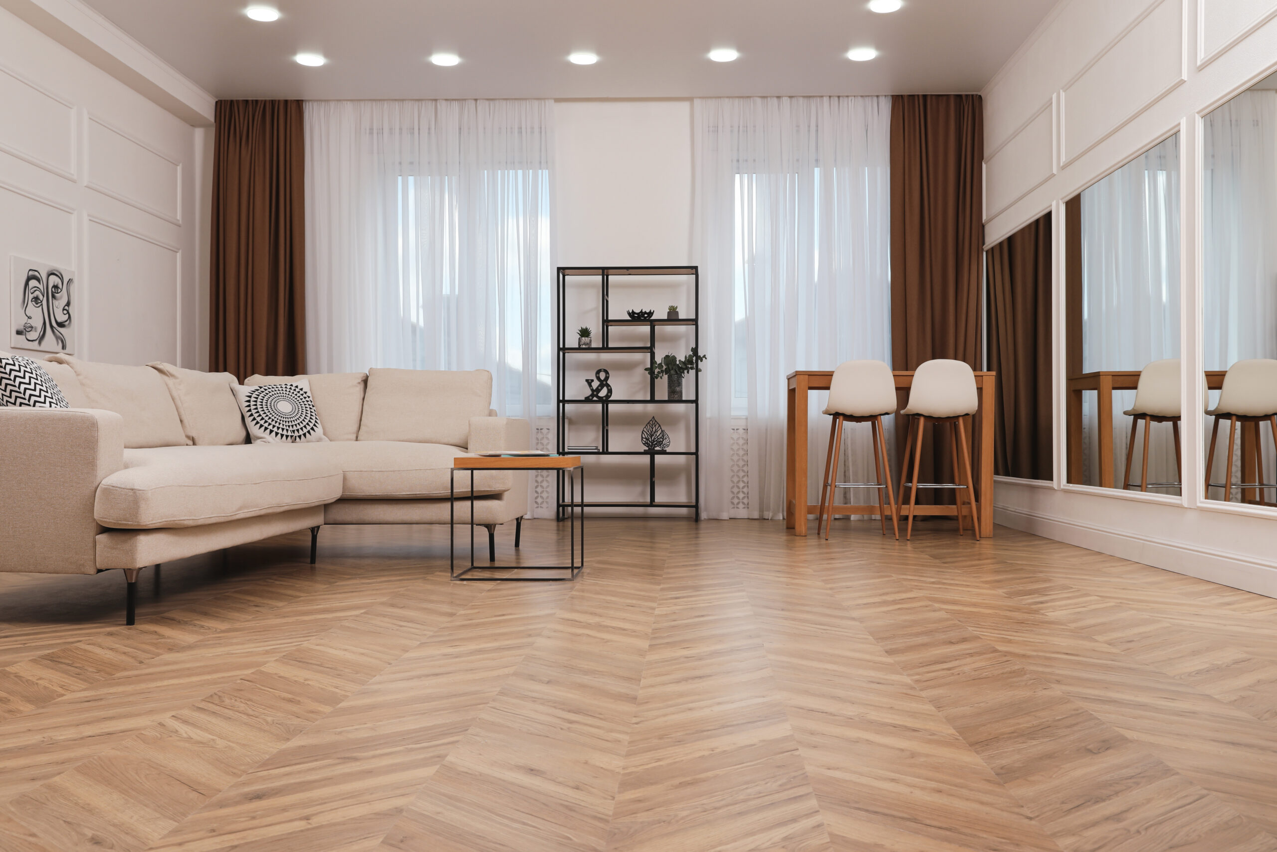 Modern living room with parquet flooring and stylish furniture