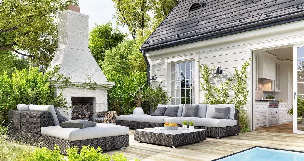 Cozy patio area with garden furniture, swimming pool and outdoor