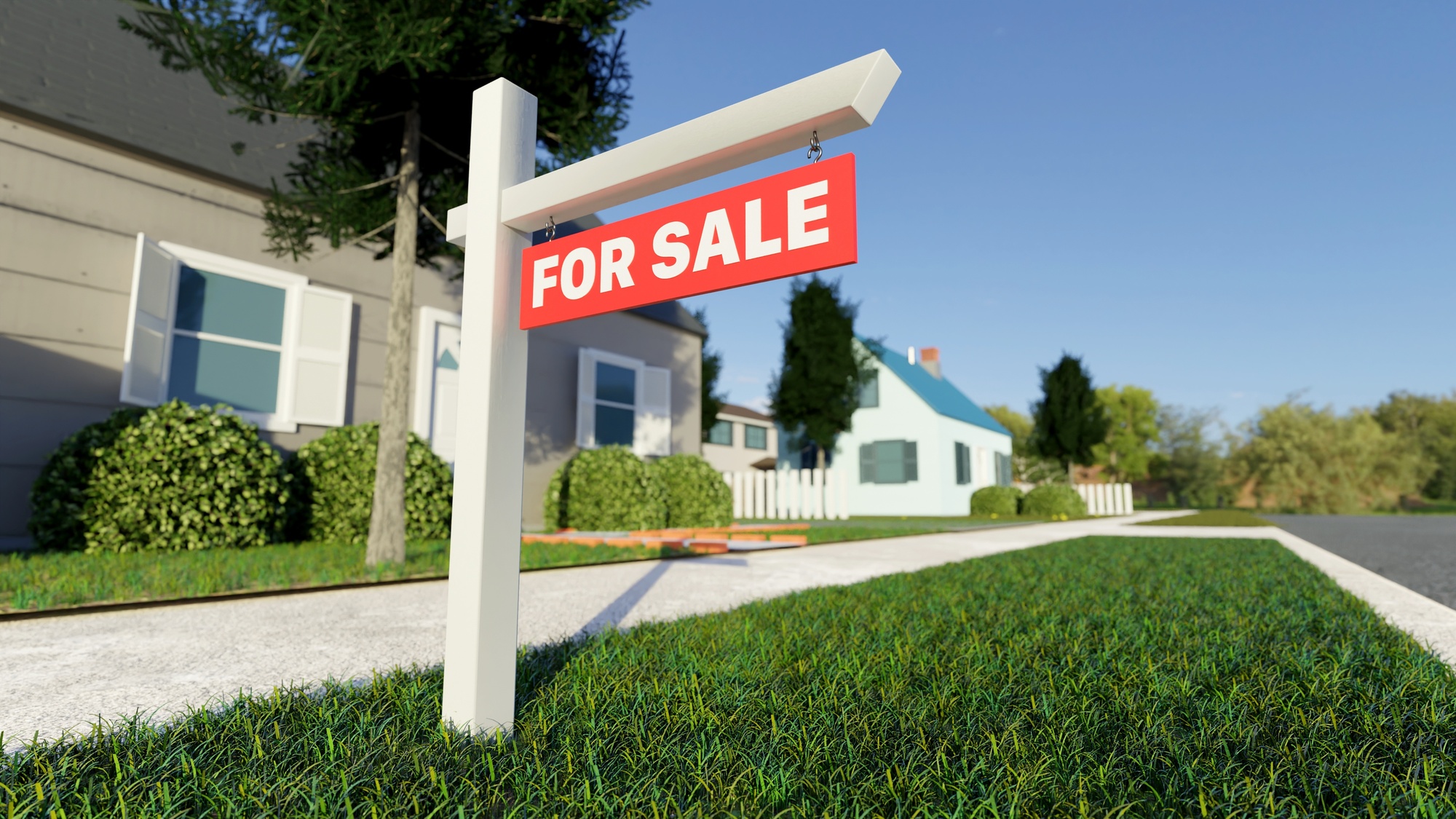Real estate sign in front of a house for sale in a nice suburban